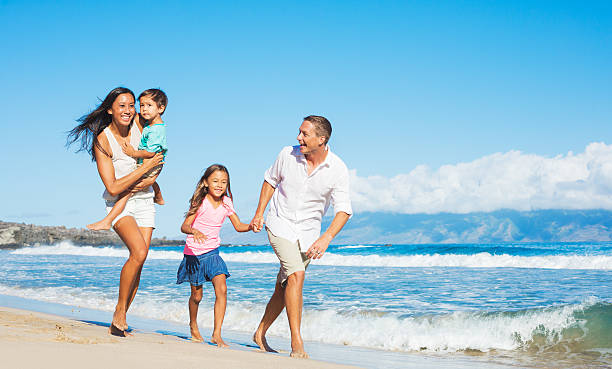 istock Happy Family on the Beach 517237901
