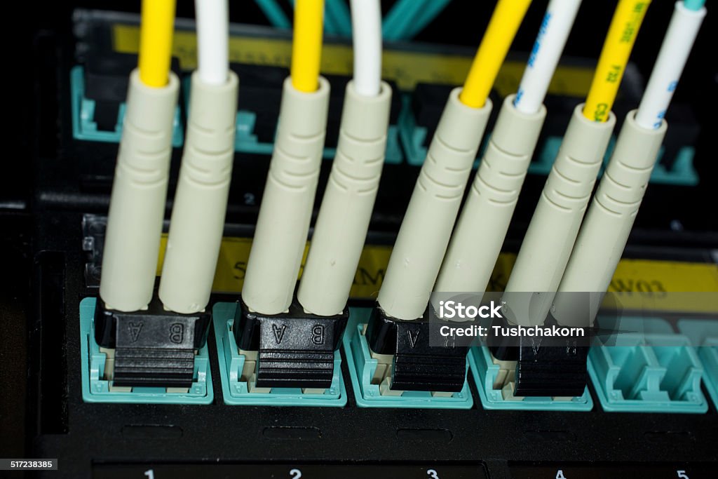 optic fiber cables connected to data center Advice Stock Photo