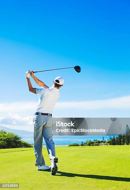 Man Playing Golf Hitting Ball From The Tee Stock Photo - Download Image Now - Golf, Teeing Off, Men