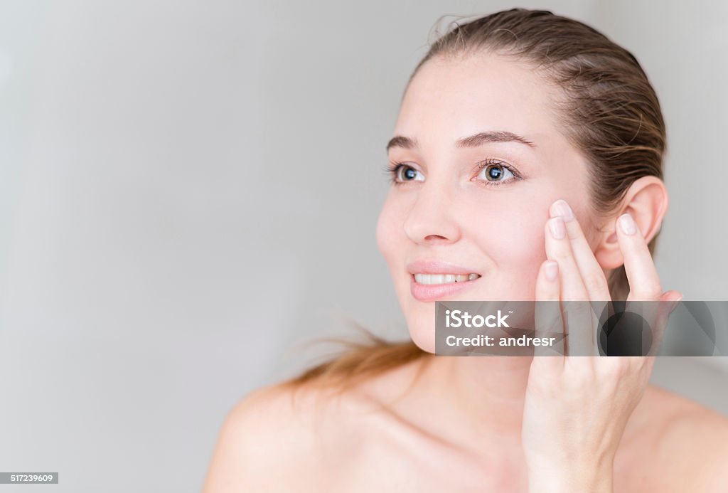 Young woman pampering her skin Young woman pampering her skin - beauty concepts 20-29 Years Stock Photo