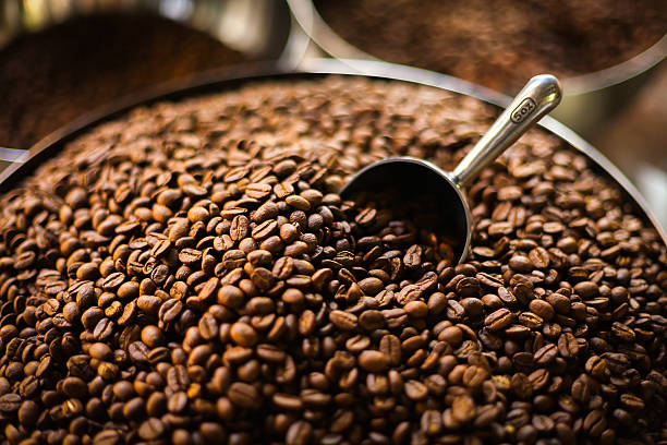 istock coffee beans with a metal scoop 517239675