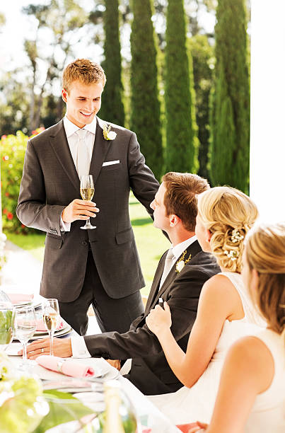 istock Best Man Looking At Couple While Giving Speech During Reception 517239903