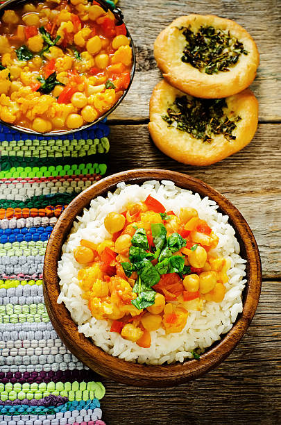 istock rice with curry chickpeas with vegetables and Arabic flat bread with herbs 517240109