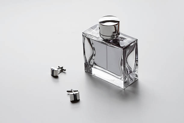 Horizontal mens cologne and cufflinks stock photo