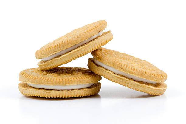 istock Vanilla cookies with cream filling on white background 517241255