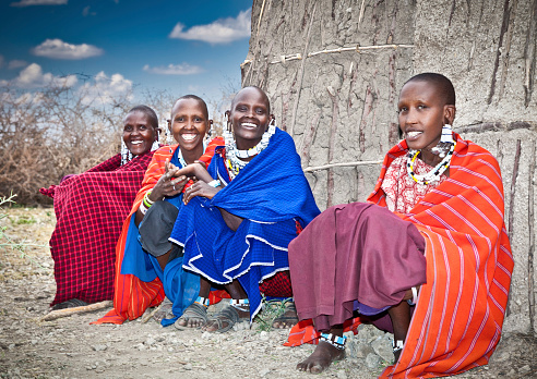 Group of Maasai warriors going back to village, central Kenya, Africa. Maasai tribe inhabiting southern Kenya and northern Tanzania, and they are related to the Samburu.