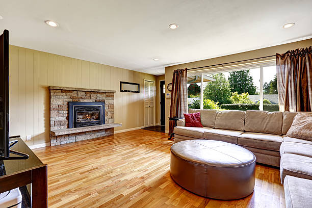 istock Living room with stone trim fireplace and comfortable sofa 517249629