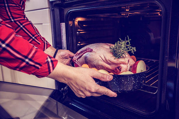 istock Preparing Traditional Holiday Goose with Side Dishes 517250925