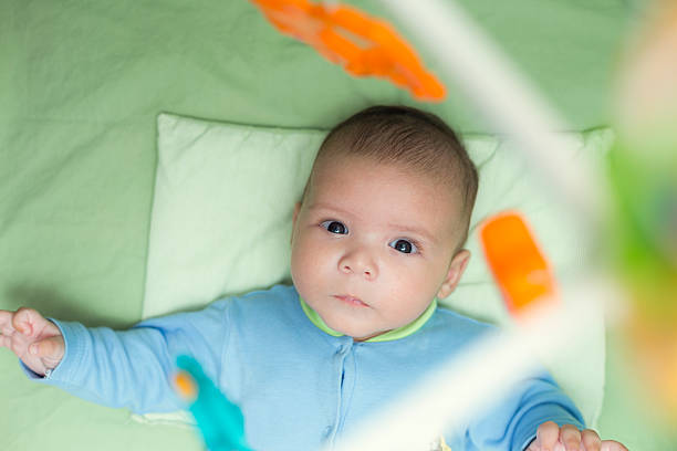 istock Baby in crib 517252275