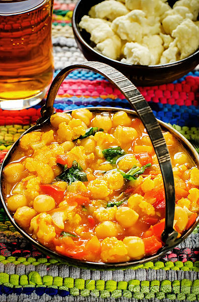 istock curry chickpea with cauliflower and vegetables 517253179