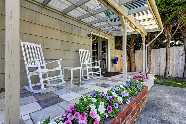 istock Walkout patio area with white rocking chairs 517253705