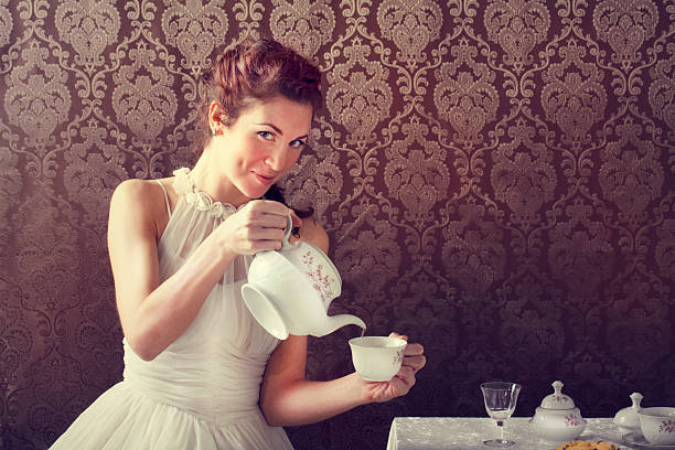 dreamer woman drinking tea at tea time stock photo