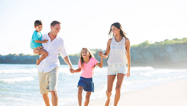 istock Happy Family on the Beach 517255219