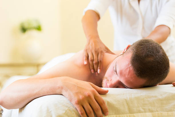 istock Man relaxing during professional massage in day spa 517255443