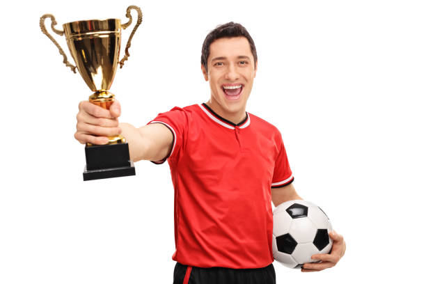 istock Delighted athlete holding a gold trophy 517268226