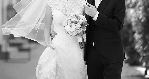 Wedding couple walking street, wedding fashion, black and white.