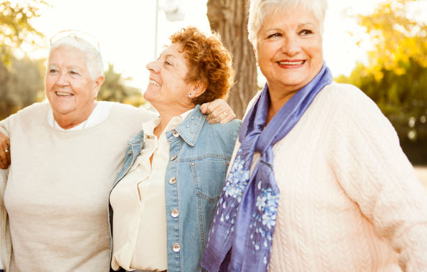 istock Senior girlfriends having fun in the park 517268702