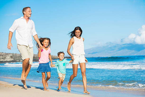 istock Happy Family on the Beach 517268765