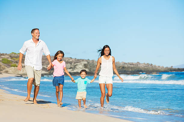 istock Happy Family on the Beach 517268783