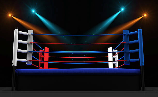 istock Boxing ring with spotlight isolated on dark background 517270842