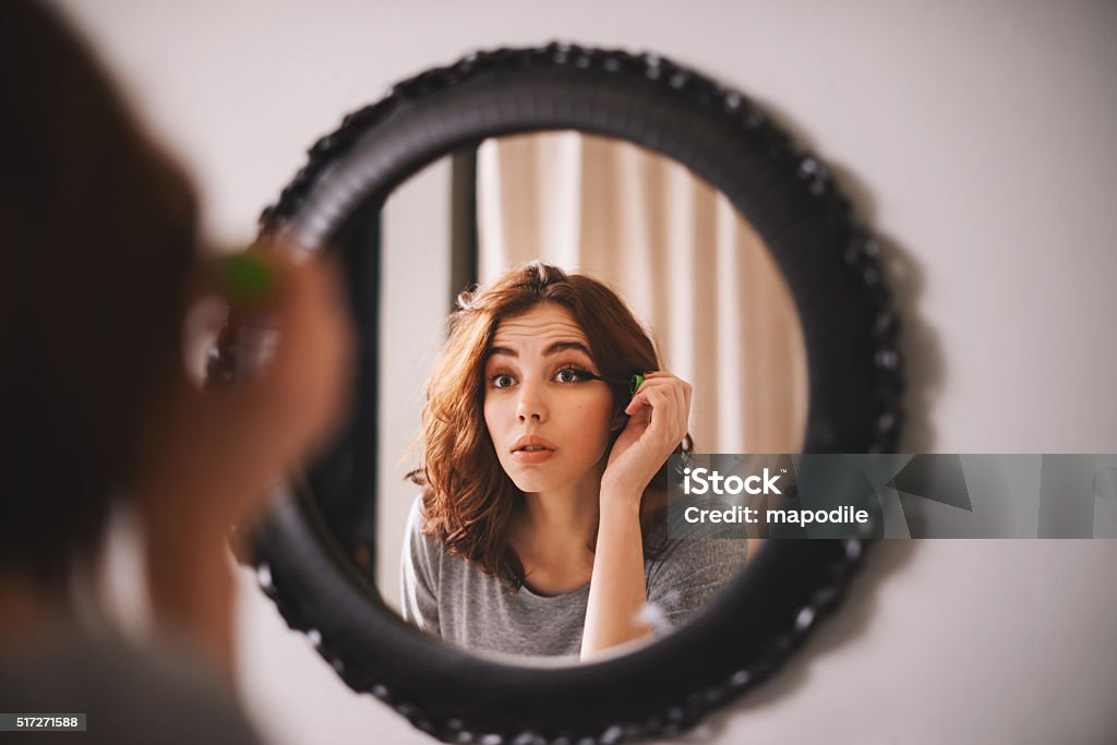 If you look good, you'll feel good Cropped shot of a young woman putting on mascara Make-Up Stock Photo