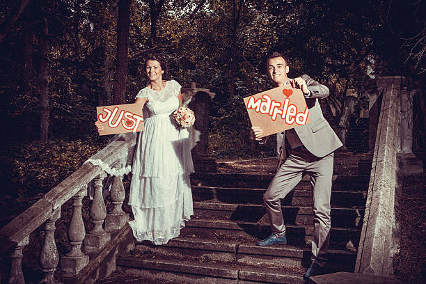 istock Happy bride and groom on ladder at wedding walk 517271854