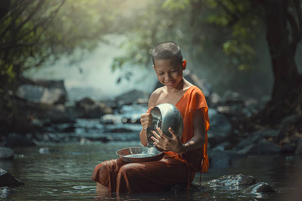 istock Novice with monk's alms bowl 517272454