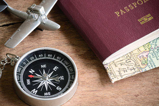 istock Compass on the old wooden background 517273596