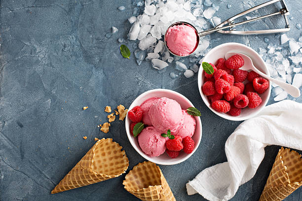 Raspberry ice cream in white bowl Raspberry ice cream in white bowl overhead shot food fruit close up strawberry stock pictures, royalty-free photos & images