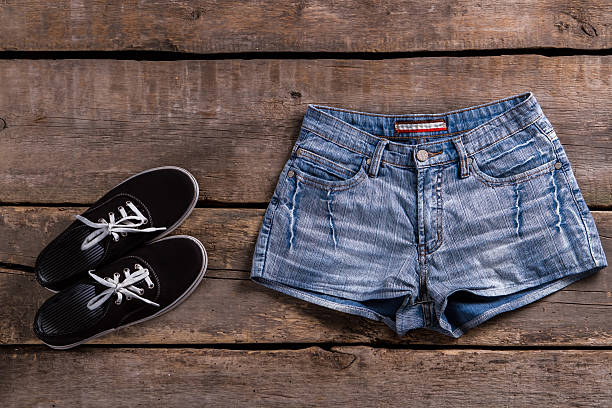 istock Denim shorts and black keds. 517276044