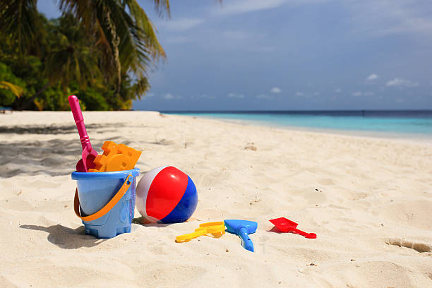istock kids toys on tropical sand beach 517278862