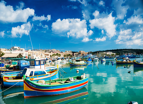 marsaxlokk harbour and traditional mediterranean fishing boats in malta island