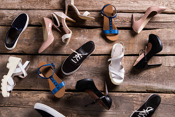 istock Different female shoes on floor. 517280250