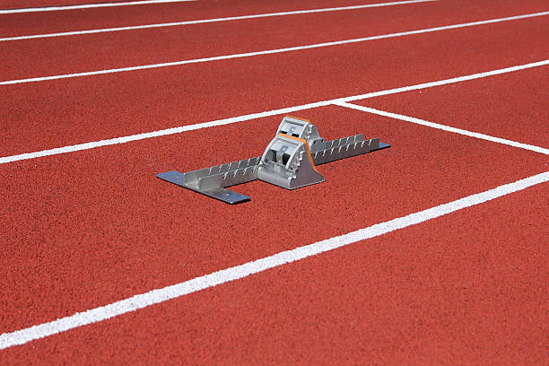 istock Athletics starting blocks on race track 517280252