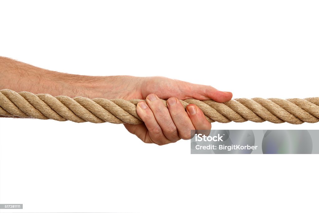 Man pulls a rope Male hand pulls a rope isolated on a white background Activity Stock Photo