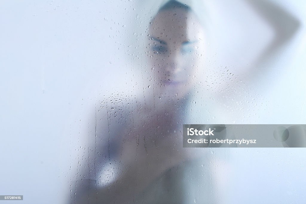Shower - girl takes a bath A woman in the shower wipes body with a towel Shower Stock Photo