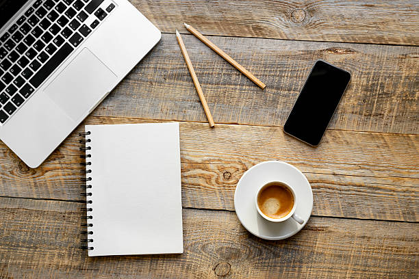 istock Working place with laptop on wooden table 517281780
