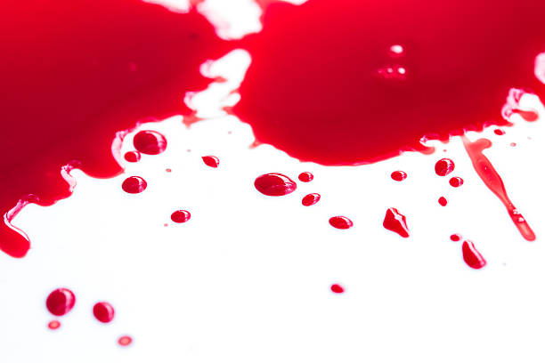 istock blood droplets on white  background 517282060