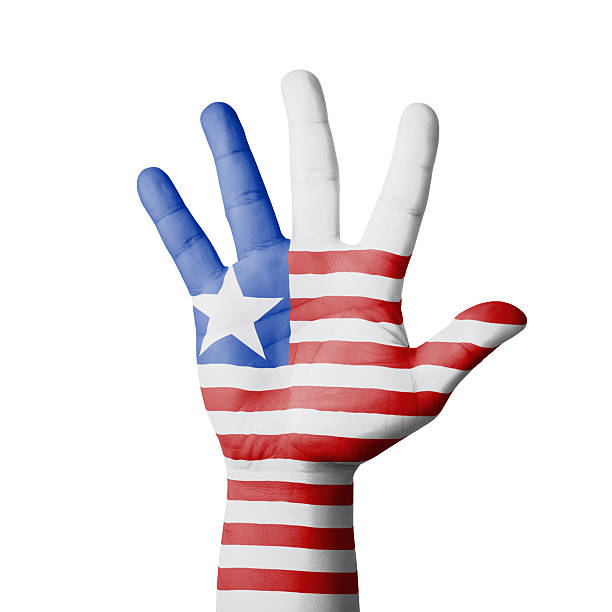 istock Open hand raised, Liberia flag painted 517284379