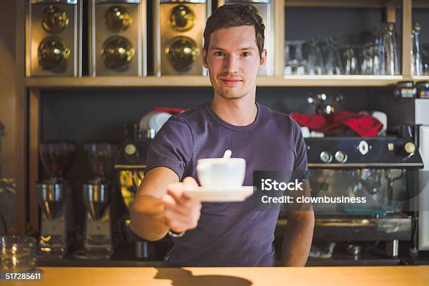 Bartender Offering Coffee Stock Photo - Download Image Now - Adult, Adults Only, Bar - Drink Establishment