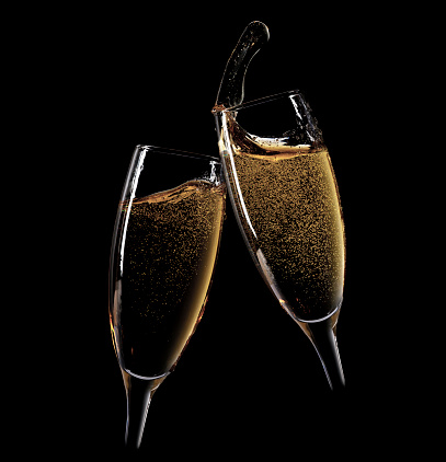 Cheers! Two champagne glasses. Isolated on black background