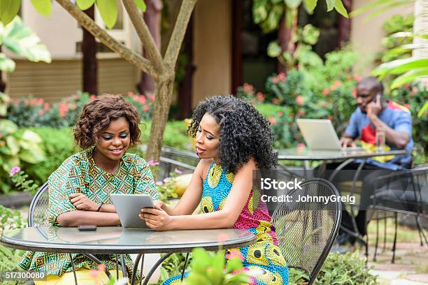 Young African Businesswomen Using Digital Tablet Stock Photo - Download Image Now - Nigeria, Nigerian Culture, Business