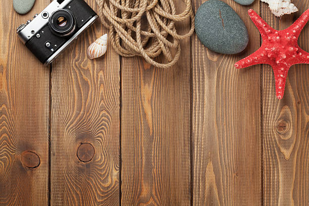 istock Travel and vacation items on wooden table 517301252