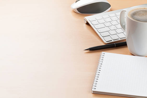 istock Office desk table with supplies and coffee cup 517302260