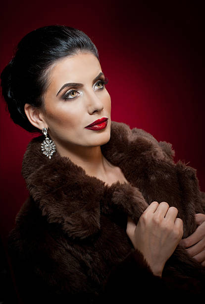 istock Gorgeous eyes brunette lady with black fur collar 517304450