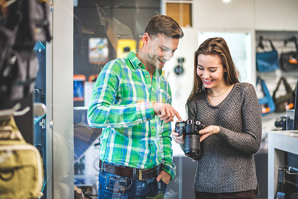 istock Explaining SLR camera to a woman 517305800