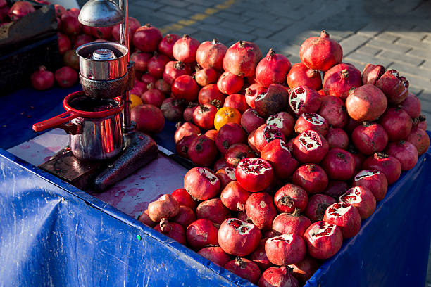 Pomegranate juice seller bench closeup