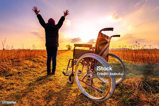 Miracle Recovery Young Girl Gets Up From Wheelchair And Raises Stock Photo - Download Image Now