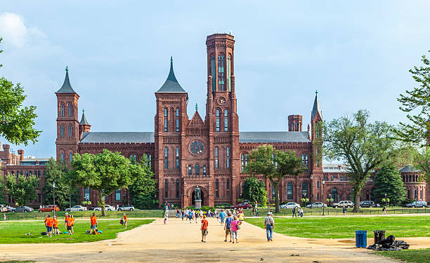 people visit Smithsonian Castle in Washington DC Washington, USA - July 14, 2010: Smithsonian Castle in Washington DC,USA . People from all over the world come to visit the Smithsonian Castle. smithsonian museums stock pictures, royalty-free photos & images