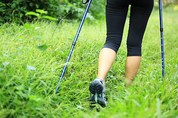 istock hiking legs in green grass 517308087